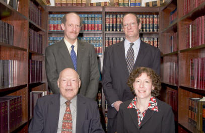Clockwise from lower left: Ernest Holzberg, Sr. Partner; David E. Holzberg, Partner; Richard M. Holzberg, Partner; Suzanne B. Holzberg, Partner
