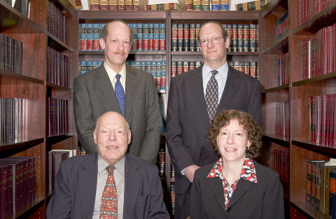 Clockwise from lower left: Ernest Holzberg, Sr. Partner; David E. Holzberg, Partner; Richard M. Holzberg, Partner; Suzanne B. Holzberg, Partner
